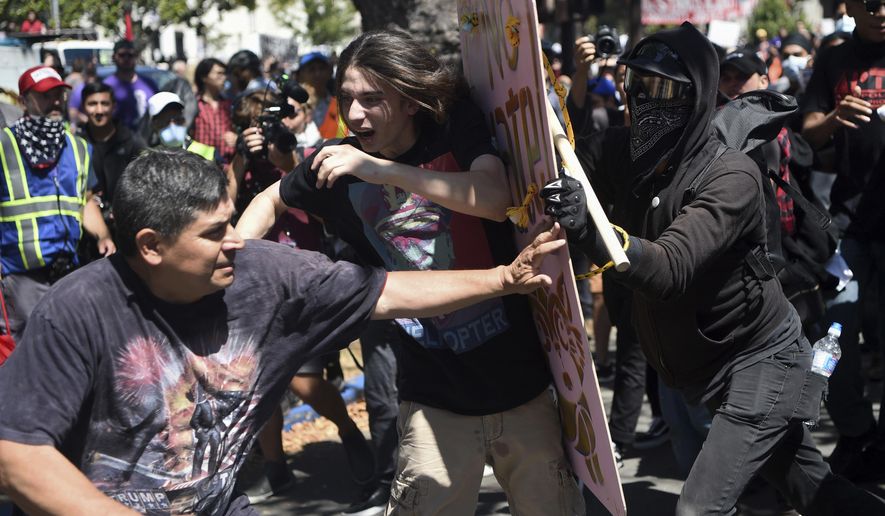 Demonstrators clash during a free speech rally Sunday, Aug. 27, 2017, in Berkeley, Calif. Several thousand people converged in Berkeley Sunday for a &amp;quot;Rally Against Hate&amp;quot; in response to a planned right-wing protest that raised concerns of violence and triggered a massive police presence. Several people were arrested for violating rules against covering their faces or carrying items banned by authorities. (AP Photo/Josh Edelson)