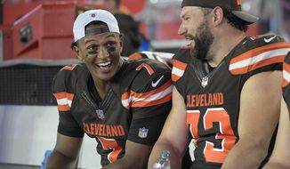 Cleveland Browns quarterback DeShone Kizer (7) shares a laugh with tackle Joe Thomas (73) during the third quarter of an NFL preseason football game against the Tampa Bay Buccaneers Saturday, Aug. 26, 2017, in Tampa, Fla. (AP Photo/Phelan Ebenhack)