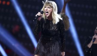 FILE - In this Feb. 4, 2017 file photo, Taylor Swift performs at the DIRECTV NOW Super Saturday Night Concert in Houston, Texas. Swift isn’t nominated for an award, but she could own the night at the 2017 MTV Video Music Awards. The pop star who dominated headlines all week with anticipation of new music will debut a music video at the show Sunday.   (Photo by John Salangsang/Invision/AP, File)