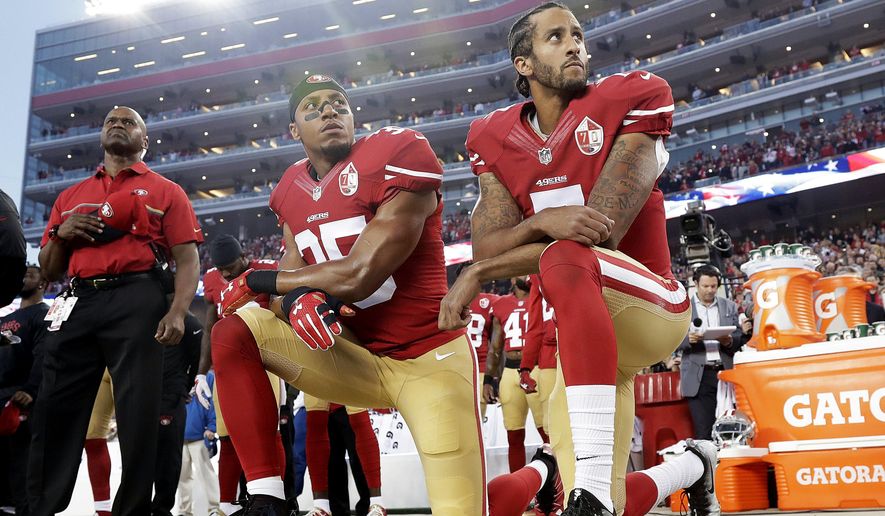 FILE - Int his Monday, Sept. 12, 2016, file photo, San Francisco 49ers safety Eric Reid (35) and quarterback Colin Kaepernick (7) kneel during the national anthem before an NFL football game against the Los Angeles Rams in Santa Clara, Calif. Reid has resumed his kneeling protest for human rights during the national anthem, after joining then-teammate Kaepernick&#39;s polarizing demonstration last season. (AP Photo/Marcio Jose Sanchez) ** FILE **