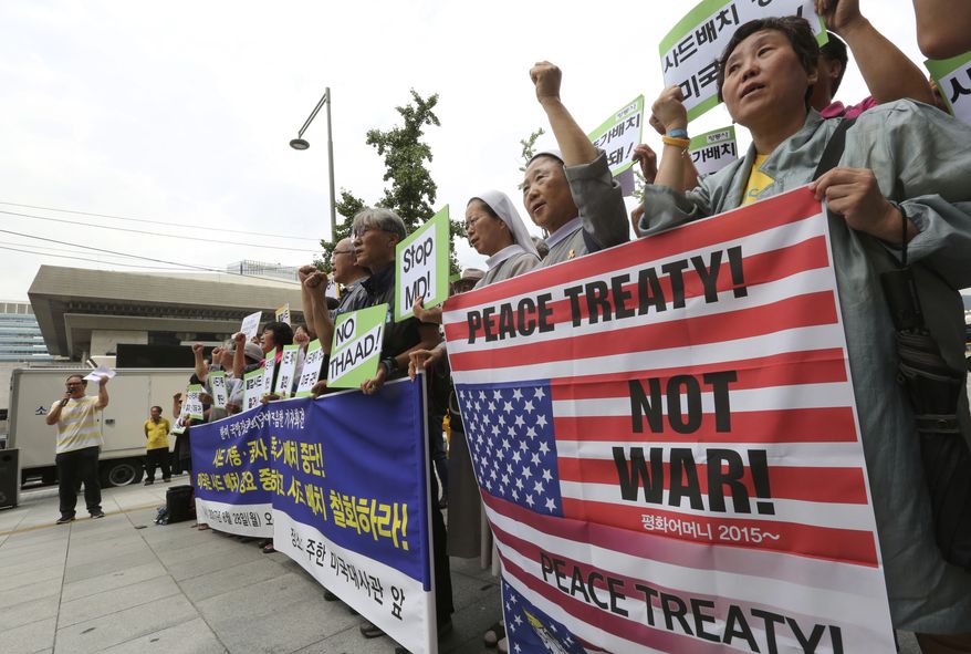 South Korean protesters stage a rally against the deployment of an advanced U.S. missile defense system called Terminal High-Altitude Area Defense, or THAAD, near the U.S. embassy in Seoul, South Korea, Monday, Aug. 28, 2017. North Korea fired several rockets into the sea Saturday in the continuation of its rapid nuclear and missile expansion, prompting South Korea to press ahead with military drills involving U.S. troops that have angered Pyongyang. (AP Photo/Ahn Young-joon)