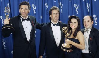 The cast of the television show “Seinfeld” (l-r) Michael Richards, Jerry Seinfeld, Julia Louise-Dreyfus, and Jason Alexander pose backstage with their awards at the 45th Annual Emmy Awards on Sunday, Sept. 19, 1993, in Pasadena, Calif. (AP Photo/Douglas C. Pizac) ** FILE **