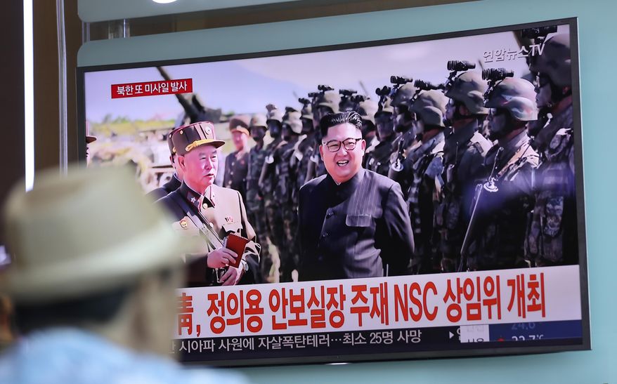 In this Saturday, Aug. 26, 2017, file photo, a man watches a screen showing an image of North Korean leader Kim Jong Un, at the Seoul Train Station in Seoul, South Korea. Three North Korea short-range ballistic missiles failed on Saturday, U.S. military officials said, which, if true, would be a temporary setback to Pyongyang's rapid nuclear and missile expansion. The banners read: "South Korean Presidential Office, National Security Director Chung Eui-yong chaired a National Security Council meeting." (AP Photo/Lee Jin-man, File)
