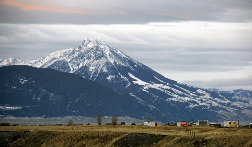 FILE - This Nov. 21, 2016, file photo shows Emigrant Peak towering over the Paradise Valley in Montana north of Yellowstone National Park, the day U.S. officials announced a ban on new mining claims across more than 30,000 acres in the area. U.S. Interior Secretary Ryan Zinke says he wants to speed up a proposal to block new gold mining claims on public lands near Yellowstone National Park and will consider blocking other types of mining. (AP Photo/Matthew Brown, File)
