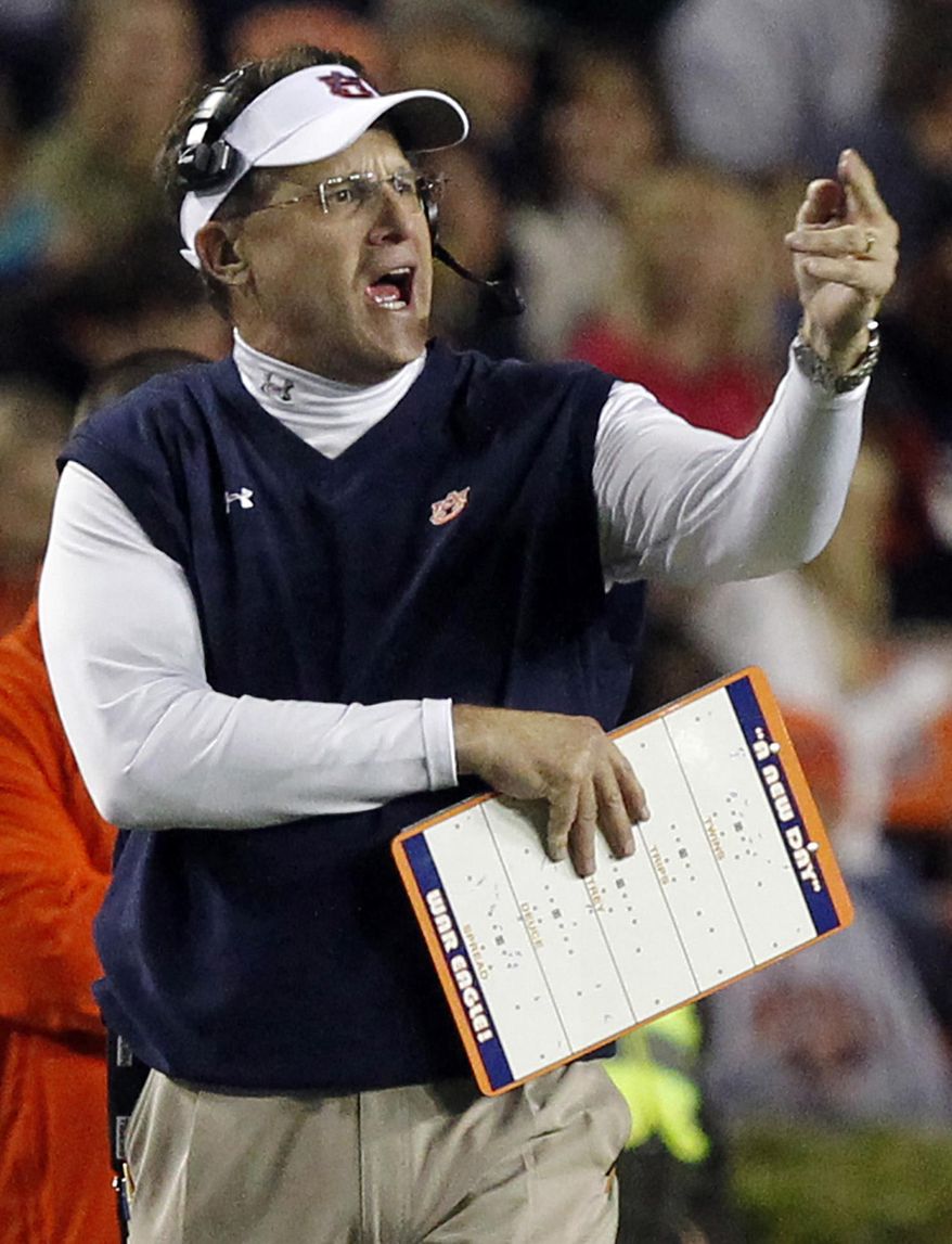 FILE - In this Oct. 26, 2013 file photo, Auburn head coach Gus Malzahn reacts to a play during the first half of an NCAA college football game against Florida Atlantic in Auburn, Ala. The Auburn Tigers have been at their best in recent seasons when nobody's expecting much out of them, and flopped at times in the face of high expectations. There’s a fair amount of positive buzz this season. The 12th-ranked Tigers open Saturday night, Sept. 2, 2017 against Georgia Southern widely regarded as the team most likely to challenge No. 1 Alabama in the Southeastern Conference Western Division. (AP Photo/Butch Dill, File)