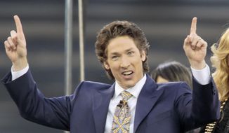 This April 24, 2010, photo shows Lakewood Church pastor Joel Osteen at Dodger Stadium during his &quot;A Night of Hope&quot; in Los Angeles. (AP Photo/Richard Vogel) **FILE**