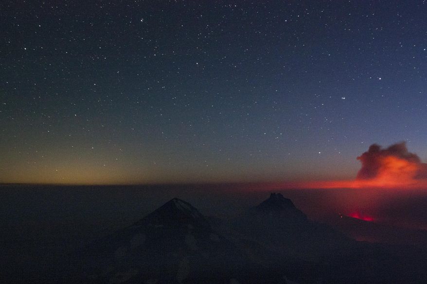 In this Sunday, Aug. 27, 2017, photo, a plume of smoke rises from a wildfire west of Sisters, Ore. Firefighters in southern Oregon on Tuesday, Aug. 29, gained a toehold on a fire burning near the coastal town of Brookings but new evacuations were ordered after a flare-up on a different complex of lightning-caused fires in a remote area near the California border. (Fedor Zarkhin/The Oregonian via AP)