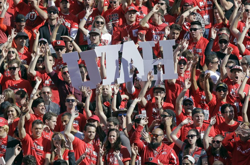 FILE - In this Saturday, Oct. 29, 2016 file photo, Utah fans show their support in the first half during an NCAA college football game against Washington in Salt Lake City. It’s Week One for the college football season. So that means Utah must be playing a Thursday night game. Utah opens the season on Thursday night, Aug. 31, 2017, as the Utes have for the past eight years. It’s just one of the scheduling quirks that abound in the Pac-12. (AP Photo/Rick Bowmer, File)