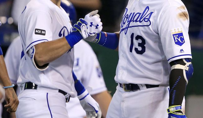Kansas City Royals&#x27; Eric Hosmer, left, celebrates his three-run home run with Salvador Perez (13) during the seventh inning of a baseball game against the Tampa Bay Rays at Kauffman Stadium in Kansas City, Mo., Tuesday, Aug. 29, 2017. (AP Photo/Orlin Wagner)