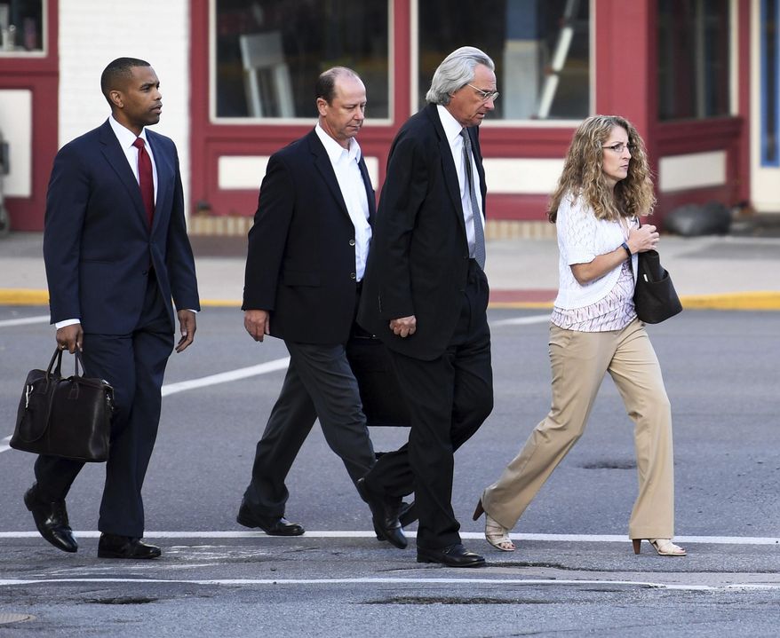 From right, Evelyn Piazza, attorney Tom Kline and Jim Piazza and walk toward the courthouse before a preliminary hearing resumes for members of a fraternity facing criminal charges over the death of Timothy Piazza, at the Centre County Courthouse in Bellefonte, Pa. Piazza, a 19-year-old sophomore, suffered severe head and abdominal injuries last February, after consuming a dangerous amount of alcohol and fell repeatedly. Help wasn't summoned until the next morning, and he later died at a hospital. (Phoebe Sheehan/Centre Daily Times via AP)