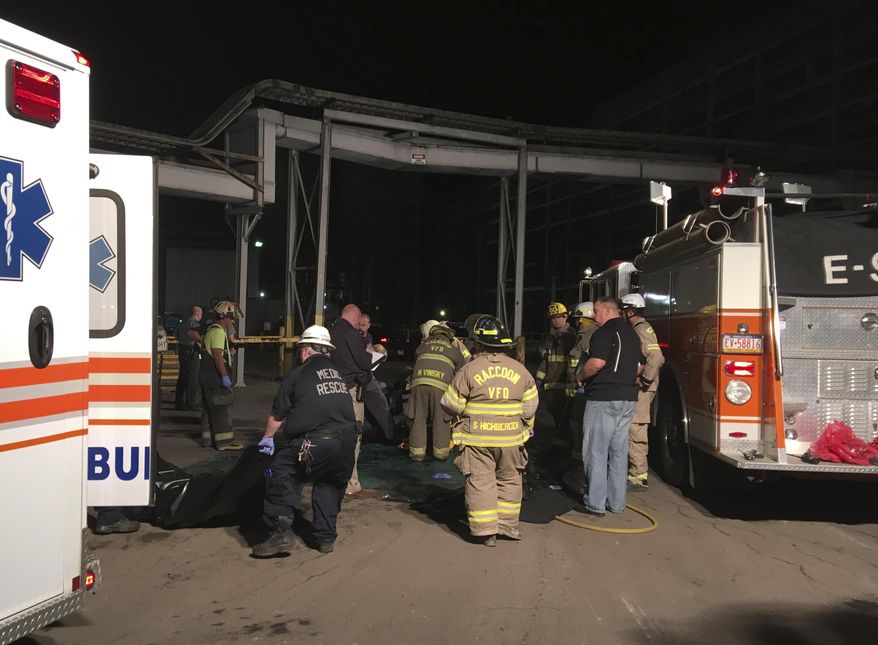 Emergency responders arrive at the First Energy Bruce Mansfield Plant early Wednesday, Aug. 30, 2017 in Shippingport, Pa. State police say two contractors working on a pipe in an underground pit at the western Pennsylvania power plant were killed when the pipe ruptured, filling the pit with sludge, late Tuesday. Police say four other workers above the pit were overcome by some kind of fumes released by the leak and taken to hospitals. (Darrell Sapp/Pittsburgh Post-Gazette via AP)