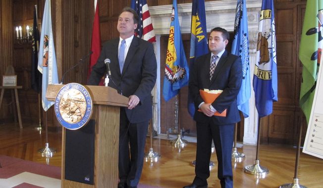 FILE - In this Nov. 15, 2016 file photo, Montana Gov. Steve Bullock, left, and the governor's budget director, Dan Villa, outline Bullock's proposed budget for the next two years in Helena. Montana government leaders plan to create rules for when and how to preserve text messages after a news organization's public-records request exposed the lack of a policy to retain the messages that have become a regular communication method for state business. Bullock's spokeswoman Ronja Abel said Monday, Aug. 28, 2017,  that Lee Newspapers of Montana's request for text messages between state lawmakers and budget director Dan Villa was the first of its kind received by the administration.  (AP Photo/Matt Volz, File)