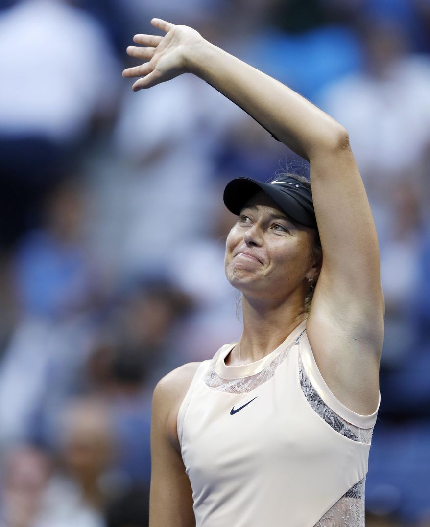Maria Sharapova, of Russia, waves to fans after beating Timea Babos, of Hungary, during the second round of the U.S. Open tennis tournament, Wednesday, Aug. 30, 2017, in New York. (AP Photo/Adam Hunger)