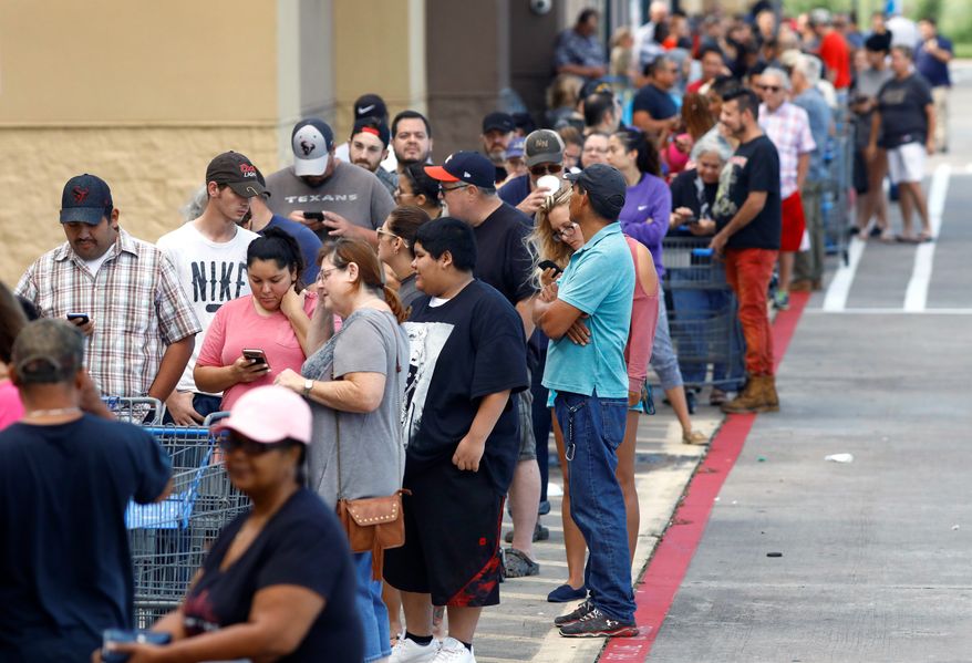 As people wait in line for necessities in short supply thanks to Hurricane Harvey, top government officials are keeping an eye on shop owners to see how they handle price gouging. (Associated Press)