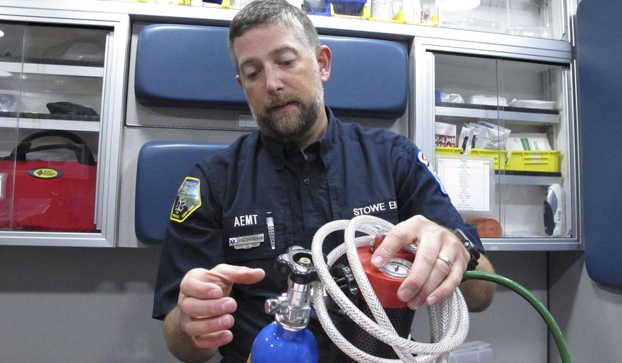 In this Tuesday, Aug. 15, 2017, photo, Scott Brinkman, chief of Stowe Department of Emergency Medical Services, demonstrates how nitrous oxide is used in an ambulance, in Stowe, Vt. Several rural ambulance crews are using nitrous oxide, or laughing gas, to treat patients&#39; pain en route to the hospital when paramedics aren&#39;t on board to provide narcotics. (AP Photo/Lisa Rathke)