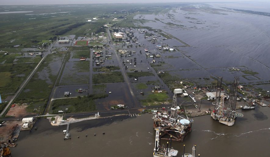 Flooding from Tropical Storm Harvey surrounds buildings in Sabine Pass, Texas, next to the Gulf of Mexico, Thursday, Aug. 31, 2017. (AP Photo/Gerald Herbert)