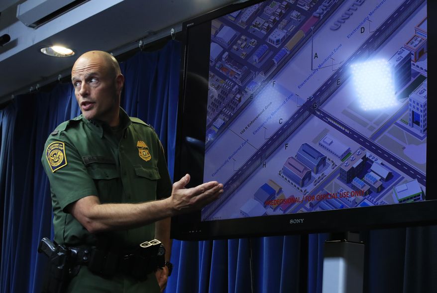 U.S. Customs and Border Protection Acting Deputy Commissioner Ronald Vitiello, shows a concept illustration of an enforcement zone of the U.S.-Mexico border during a news conference announcing the selected vendors for construction of the concrete wall prototypes for the border wall Thursday, Aug. 31, 2017 in Washington. (AP Photo/Manuel Balce Ceneta)