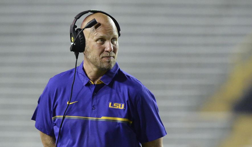 FILE - In this April 22, 2017, file photo, LSU offensive coordinator Matt Canada coaches in the first half of the NCAA college football team's spring game, in Baton Rouge, La. LSU's old offense suited Derrius Guice fine when he set an LSU single-game rushing record with one of the most dominant performances in all of college football last season. Still, he's had to accept a new scheme under a new coordinator, and have faith that it'll all work out for the 13th-ranked Tigers. (Hilary Scheinuk/The Advocate via AP, File) **FILE**