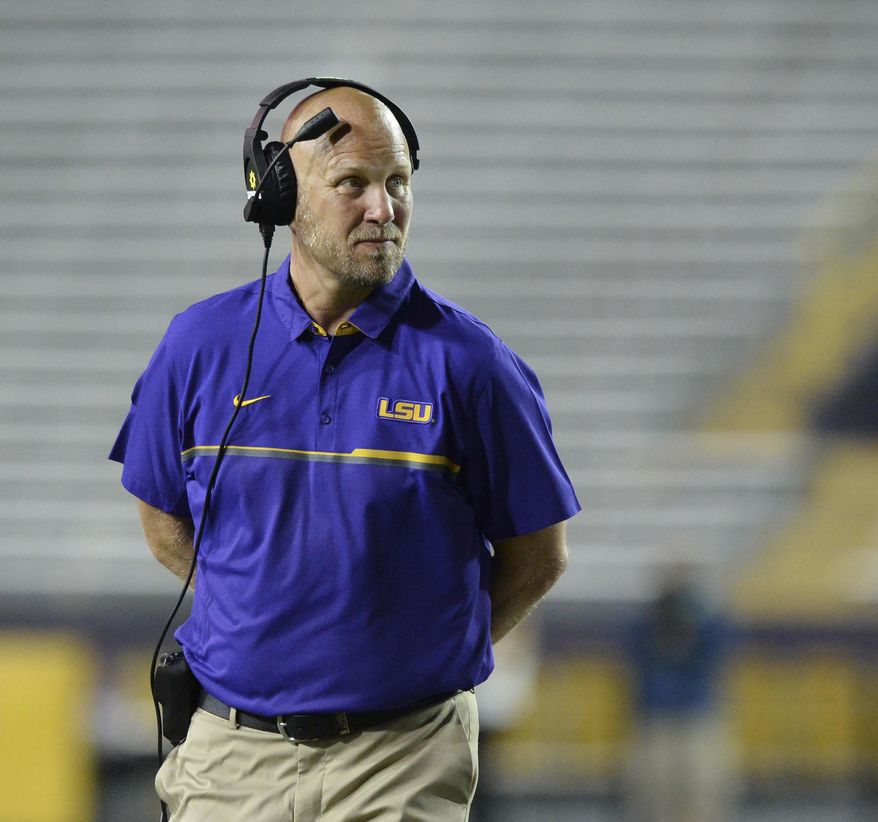 FILE - In this April 22, 2017, file photo, LSU offensive coordinator Matt Canada coaches in the first half of the NCAA college football team's spring game, in Baton Rouge, La. LSU's old offense suited Derrius Guice fine when he set an LSU single-game rushing record with one of the most dominant performances in all of college football last season. Still, he's had to accept a new scheme under a new coordinator, and have faith that it'll all work out for the 13th-ranked Tigers. (Hilary Scheinuk/The Advocate via AP, File) **FILE**