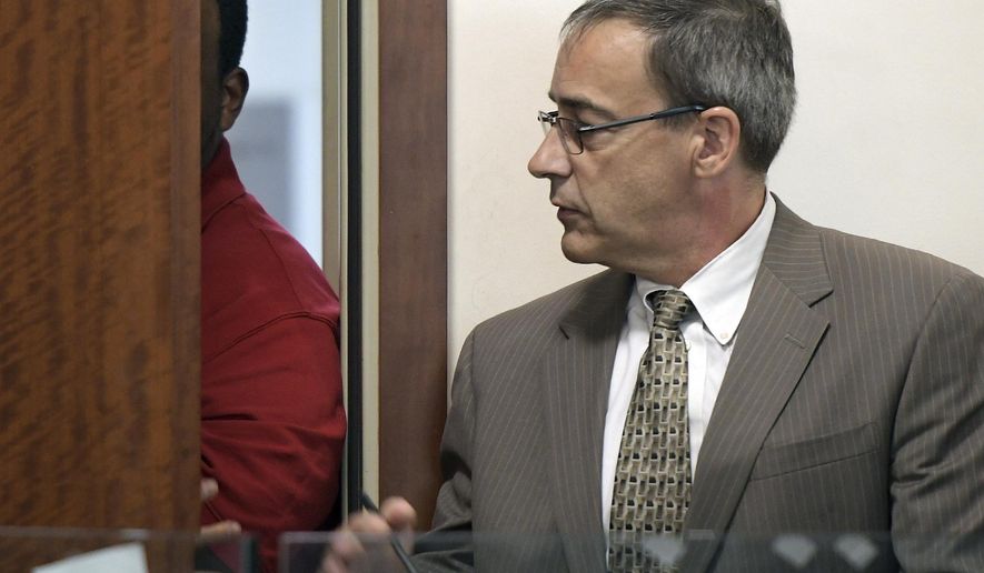 Joshua Hubert, who was allowed to stay out of view, attends his arraignment in Central District Court in Worcester, Mass., with lawyer Richard Welsh, right, Monday, Aug. 28, 2017. Police in Massachusetts say a 7-year-old girl was kidnapped from her grandparents' home and thrown from a bridge into a lake but survived. Police say the girl was taken Sunday from the Worcester home by family friend Hubert. (Rick Cinclair/Worcester Telegram & Gazette via AP, Pool)