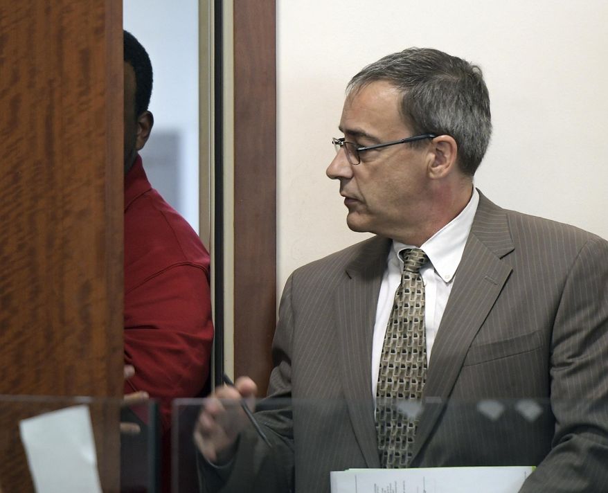Joshua Hubert, who was allowed to stay out of view, attends his arraignment in Central District Court in Worcester, Mass., with lawyer Richard Welsh, right, Monday, Aug. 28, 2017. Police in Massachusetts say a 7-year-old girl was kidnapped from her grandparents' home and thrown from a bridge into a lake but survived. Police say the girl was taken Sunday from the Worcester home by family friend Hubert. (Rick Cinclair/Worcester Telegram & Gazette via AP, Pool)