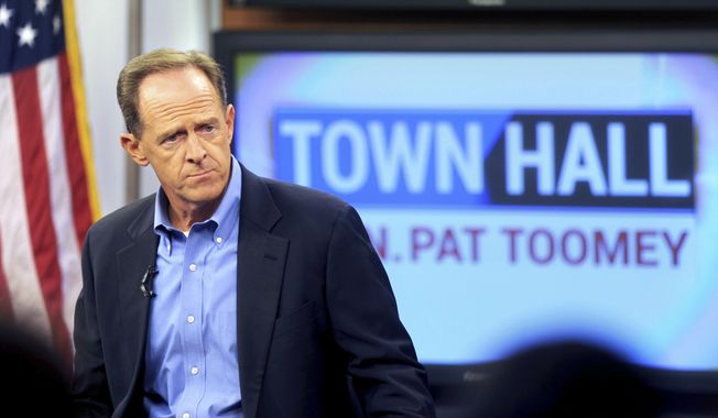 Sen. Pat Toomey holds a town-hall meeting at the WLVT / PBS 39-TV studios, Thursday, Aug. 31, 2017 in Bethlehem, Pa. Pennsylvania U.S. Sen. Pat Toomey predicts Congress will move quickly on an emergency aid package for victims of Hurricane Harvey when lawmakers return from their August recess next week. (Tom Gralish/The Philadelphia Inquirer via AP)
