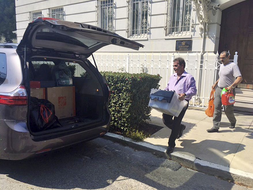 Workers carried boxes out of the Russian Consulate in San Francisco on Sept. 1, a day after the Trump administration ordered its closure amid escalating tensions between Washington and Moscow. (Associated Press)