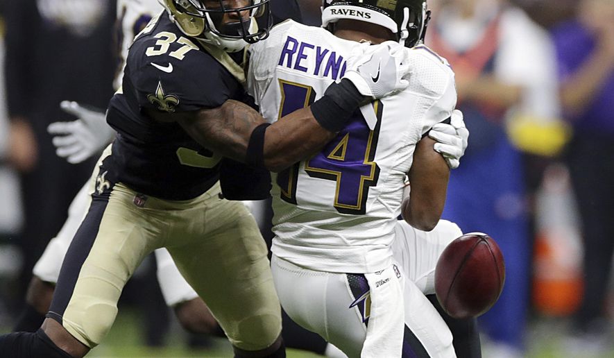 Baltimore Ravens wide receiver Keenan Reynolds (14) fumbles the ball as New Orleans Saints cornerback Arthur Maulet (37) attempts to recover, during the second half of an NFL preseason football game, Thursday, Aug. 31, 2017, in New Orleans. (AP Photo/Rusty Constanza)