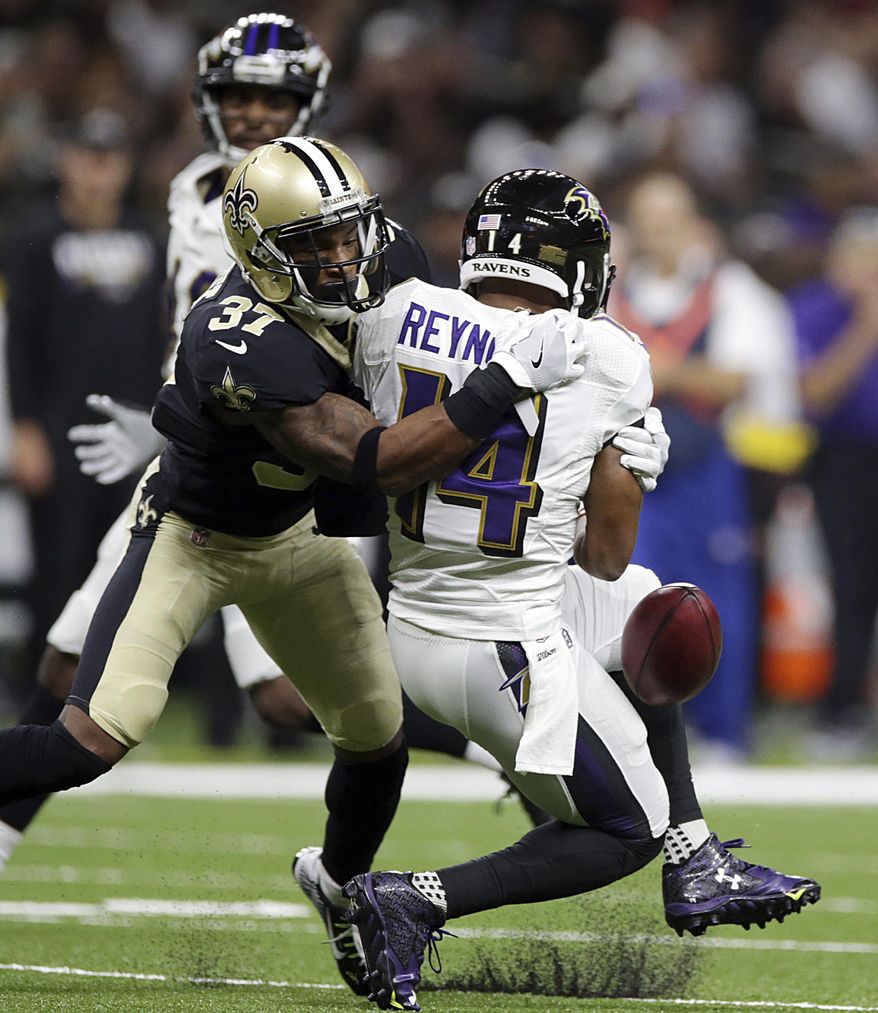 Baltimore Ravens wide receiver Keenan Reynolds (14) fumbles the ball as New Orleans Saints cornerback Arthur Maulet (37) attempts to recover, during the second half of an NFL preseason football game, Thursday, Aug. 31, 2017, in New Orleans. (AP Photo/Rusty Constanza)