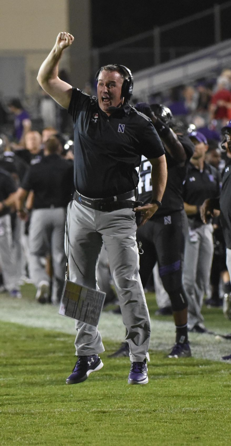FILE - In this Sept. 24, 2016, file photo, Northwestern head coach Pat Fitzgerald yells from the sidelines during the first quarter of an NCAA college football game against Nebraska in Evanston, Ill. With more wins than any other Northwestern coach and two of the Wildcats’ three bowl victories, Pat Fitzgerald could call his tenure a success. Yet there’s something missing as he enters his 12th season _ first-place finishes. (AP Photo/Matt Marton, File)