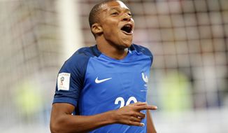 France&#39;s Kylian Mbappe reacts after scoring France&#39; s fourth goal during the World Cup Group A qualifying soccer match between France and The Netherlands at the Stade de France stadium in Saint-Denis, outside Paris, Thursday, Aug.31, 2017. (AP Photo/Christophe Ena)