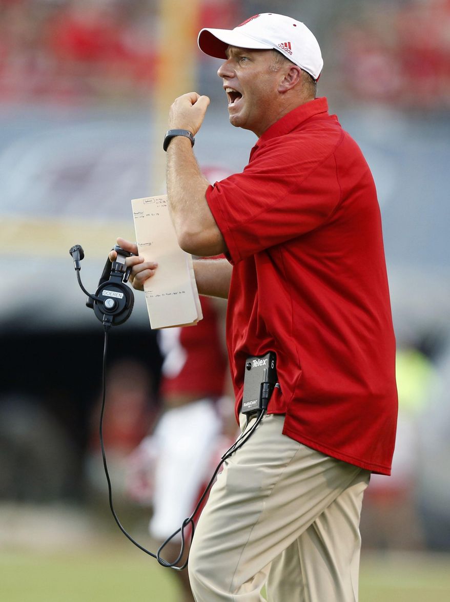 FILE - In this Sept. 17, 2016, file photo, North Carolina State head coach Dave Doeren argues a call during the first half of an NCAA college football game against Old Dominion at Carter-Finley Stadium in Raleigh, N.C. N.C. State is opening the season against a power-conference opponent for the first time under the fifth-year coach. (Ethan Hyman/The News & Observer via AP, File)