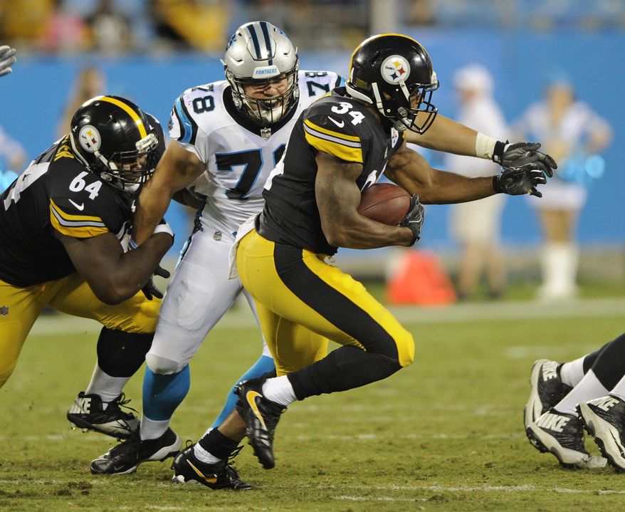 Pittsburgh Steelers' Knile Davis (34) runs past Carolina Panthers' Connor Wujciak (78) in the second half of an NFL preseason football game in Charlotte, N.C., Thursday, Aug. 31, 2017. (AP Photo/Mike McCarn)
