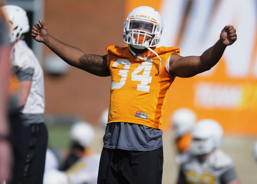 FILE - In this March 23, 2017 file photo, Tennessee linebacker Darrin Kirkland Jr. stretches during a spring football practice in Knoxville, Tenn. Kirkland has a knee injury that will sideline him for the start of the season. (Calvin Mattheis/Knoxville News Sentinel via AP, File)