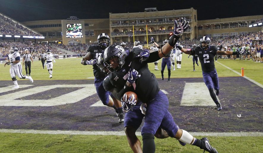 TCU linebacker Arico Evans (7) celebrates his 32-yard touchdown on a fumble recover against Jackson State during the second half of an NCAA college football game in Fort Worth, Texas, Saturday, Sept. 2, 2017. (Rodger Mallison/Star-Telegram via AP)