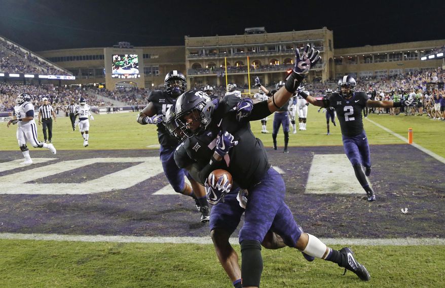 TCU linebacker Arico Evans (7) celebrates his 32-yard touchdown on a fumble recover against Jackson State during the second half of an NCAA college football game in Fort Worth, Texas, Saturday, Sept. 2, 2017. (Rodger Mallison/Star-Telegram via AP)