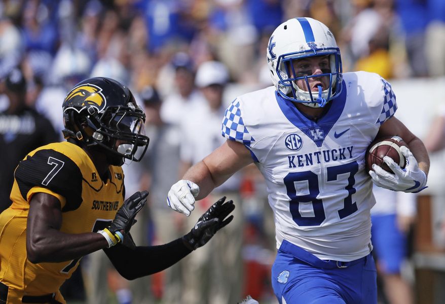 Kentucky tight end C.J. Conrad (87) rushes past Southern Mississippi defensive back Jomez Applewhite (7) for a 59-yard first half pass reception during an NCAA college football game in Hattiesburg, Miss., Saturday, Sept. 2, 2017. (AP Photo/Rogelio V. Solis)