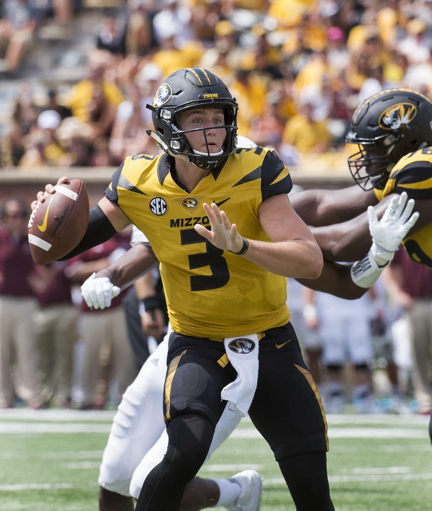 Missouri quarterback Drew Lock scrambles as he throws the ball during the third quarter of an NCAA college football game against Missouri State Saturday, Sept. 2, 2017, in Columbia, Mo. (AP Photo/L.G. Patterson)