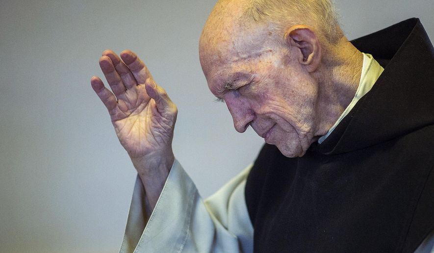 In a Wednesday, Aug. 23, 2017 photo, Father Patrick blesses the Vore family, of Farr West, in the bookstore and gift shop at the Abbey of Our Lady of the Holy Trinity in Huntsville, Utah. Father Patrick, the last monk, has left the Huntsville monastery, shuttering the 70-year-old Utah landmark. The Salt Lake Tribune reports the Rev. Boyle, 89, has left the Abbey of Our Lady of the Holy Trinity to join his brethren at St. Joseph Villa Catholic nursing home in Salt Lake City. (Chris Detrick/The Salt Lake Tribune via AP)/The Salt Lake Tribune via AP)