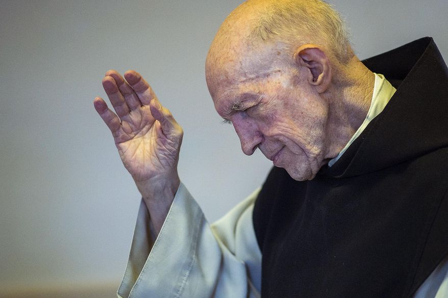 In a Wednesday, Aug. 23, 2017 photo, Father Patrick blesses the Vore family, of Farr West, in the bookstore and gift shop at the Abbey of Our Lady of the Holy Trinity in Huntsville, Utah. Father Patrick, the last monk, has left the Huntsville monastery, shuttering the 70-year-old Utah landmark. The Salt Lake Tribune reports the Rev. Boyle, 89, has left the Abbey of Our Lady of the Holy Trinity to join his brethren at St. Joseph Villa Catholic nursing home in Salt Lake City. (Chris Detrick/The Salt Lake Tribune via AP)/The Salt Lake Tribune via AP)