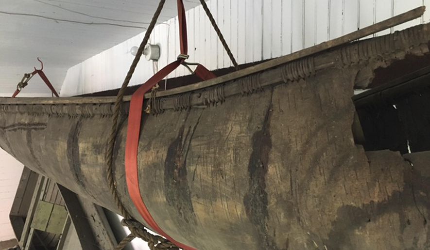 In a 2017 photo, a Wabanaki-made birch canoe that was carbon-dated to the 1700s is seen hanging in a barn behind the Pejepscot Historical Society museum in Brunswick, Maine. The canoe, possibly the oldest such canoe in existence, has been removed for conservation and will go on display inside the museum as early as this fall. (Pejepscot Historical Society/Larissa Vigue Picard via AP)