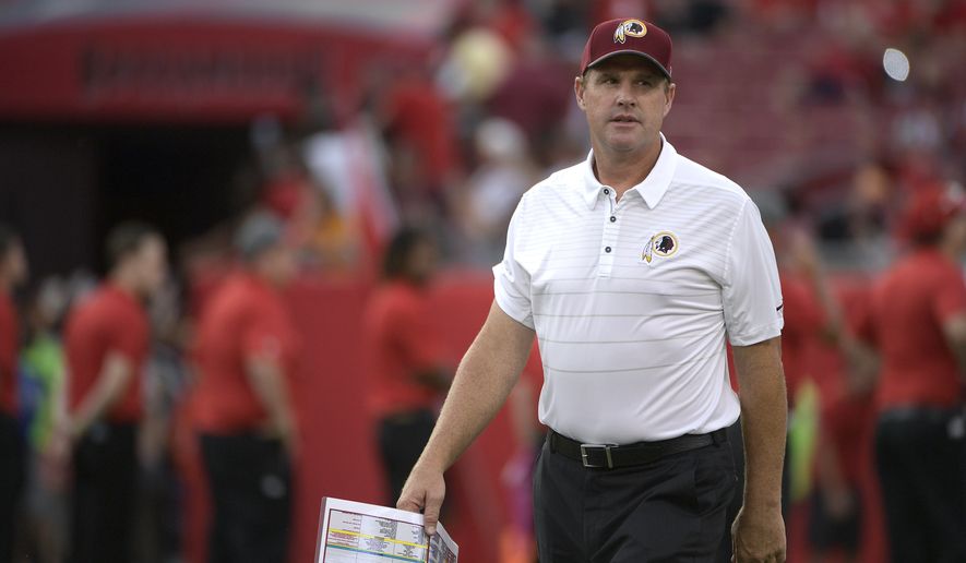 Washington Redskins head coach Jay Gruden walks to the sideline before the start of an NFL preseason football game against the Tampa Bay Buccaneers Thursday, Aug. 31, 2017, in Tampa, Fla. (AP Photo/Phelan M. Ebenhack)