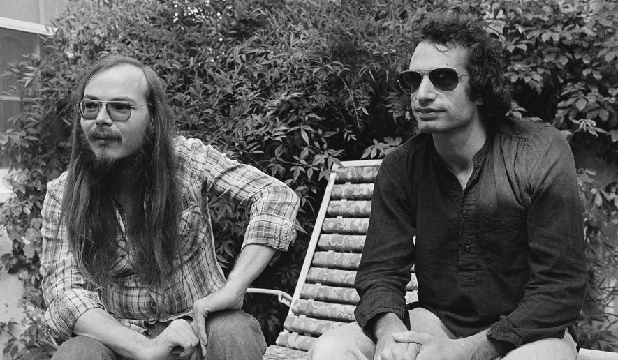 FILE - In this Oct. 29, 1977, file photo, Walter Becker, left, and Donald Fagen of Steely Dan, sit in Los Angeles. Becker, the guitarist, bassist and co-founder of the rock group Steely Dan, has died. He was 67. His official website announced his death Sunday, Sept. 3, 2017, with no further details. (AP Photo/Nick Ut, File)