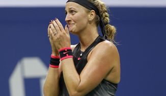 Petra Kvitova, of the Czech Republic, reacts after defeating Garbine Muguruza, of Spain, 7-6 (3), 6-3, in straight sets in their fourth-round match at the U.S. Open tennis tournament in New York, Sunday, Sept. 3, 2017. (AP Photo/Kathy Willens)