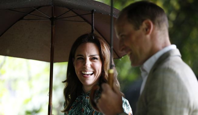 In this Wednesday, Aug. 30, 2017, file photo Britain&#x27;s Prince William and his wife Kate, Duchess of Cambridge smile as they walk through the memorial garden in Kensington Palace, London. Kensington Palace says Prince William and his wife, the Duchess of Cambridge, are expecting their third child. The announcement released in a statement Monday Sept. 4, 2017, says the queen is delighted by the news. (AP Photo/Kirsty Wigglesworth, File)