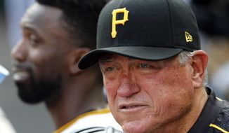 Pittsburgh Pirates manager Clint Hurdle, right, stands in the dugout during a baseball game against the Chicago Cubs in Pittsburgh, Monday, Sept. 4, 2017. (AP Photo/Gene J. Puskar)