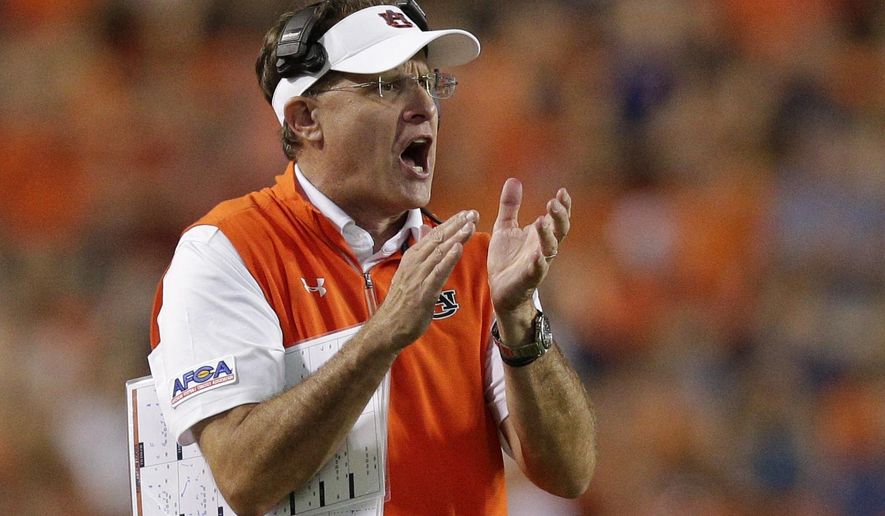 Auburn head coach Gus Malzahn claps to get his players attention in the second half of an NCAA college football game against Georgia Southern, Saturday, Sept. 2, 2017, in Auburn, Ala. Auburn won 41-7. (AP Photo/Brynn Anderson)