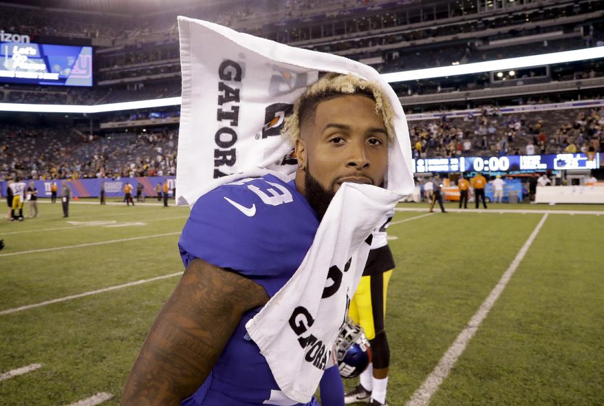 FILE - In this Aug. 11, 2017, file photo, New York Giants wide receiver Odell Beckham (13) walks off the field after a preseason NFL football game against the Pittsburgh Steelers, in East Rutherford, N.J. Eli Manning has an outstanding corps of receivers in Odell Beckham Jr., Brandon Marshall, Sterling Shepard and rookie tight end Evan Engram.(AP Photo/Julio Cortez, File)