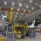FILE - In this file photo dated Monday, June 12, 2017, a Boeing 777 plane on the assembly line in Everett, Washington.  The World Trade Organization on Monday Sept. 4, 2017, rejected claims by the European Union against tax incentives provided by Washington state to Boeing, handing a victory to the U.S. plane maker.(AP Photo/Ted S. Warren, FILE)