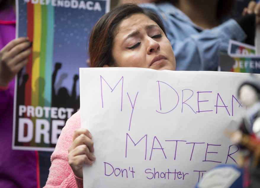 Evelin Hernandez cries as she hold a sign reading "My dreams matter. Don't shatter them." at a protest against the announcement that the Trump administration is ending the Deferred Action for Childhood Arrivals program, known as DACA, in Minneapolis, Tuesday, Sept. 5, 2017. Hernandez is a special education paraprofessional and a DREAM act recipient. (Renee Jones Schneider/Star Tribune via AP)